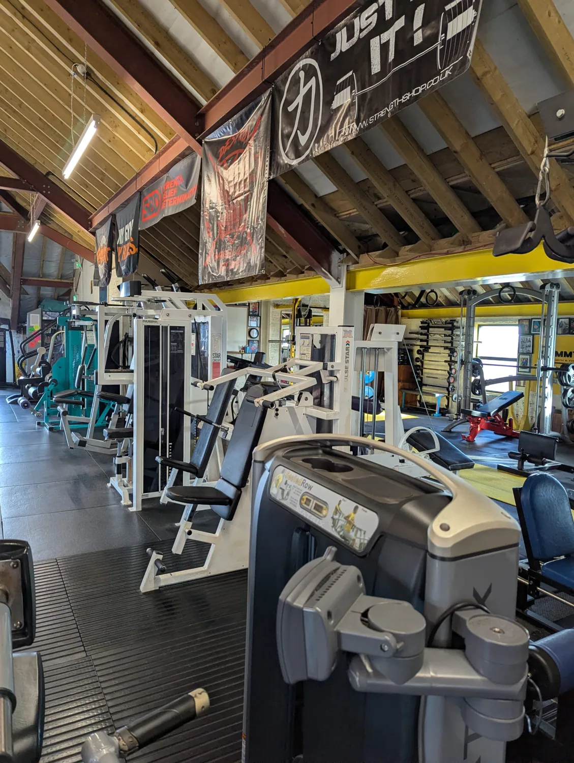 Wide view of the real training floor at Sammy’s Gym